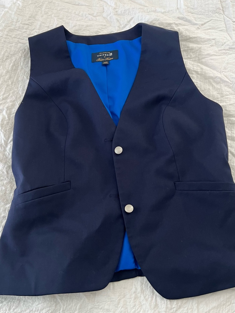 United Airlines 
Brooks Brothers Navy Vest with Bright Blue Lining